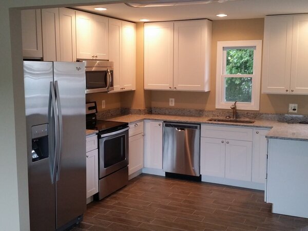 Tile flooring in kitchen that looks like stone