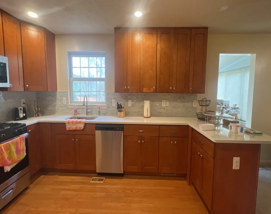 A kitchen design with tall cabinetry.